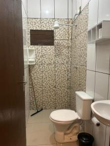 a small bathroom with a toilet and a sink at GOLDEN ROSE HOTEL in Campinas +13 photos