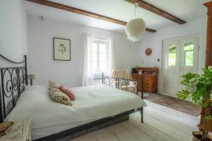 Ένα ή περισσότερα κρεβάτια σε δωμάτιο στο Chata Wróżki Mrozowej +37 φωτογραφίες