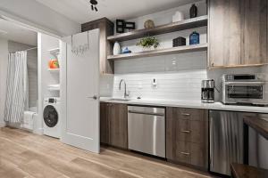 a kitchen with a sink and a microwave at Centrally Located Lake Oswego Studio in Lake Oswego