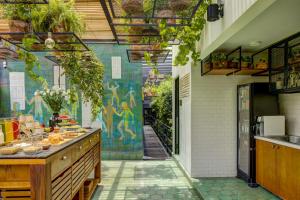 a kitchen with a counter with food on it at Roso Guest House in Mexico City
