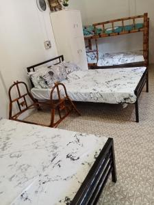 Ένα ή περισσότερα κρεβάτια σε δωμάτιο στο MARI-GOLD Travelers Inn