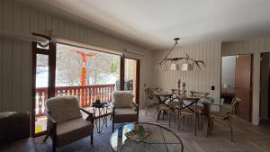 a dining room with a table and chairs at Vista Nevada in Nevados de Chillan