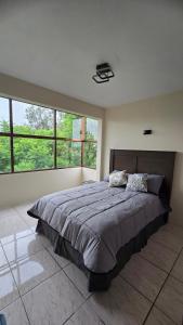 En eller flere senge i et værelse på Departamento acogedor