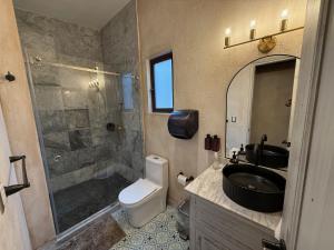 a bathroom with a sink and a shower and a toilet at Apolo en ValQuirico in Santeagueda +38 photos