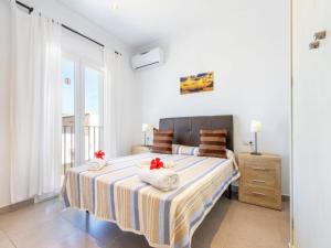 a bedroom with a large bed with towels on it at Modern Villa with Pool in Cala d'Or in Cala D'or +36 photos