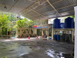 a building under construction with orange cones in the middle at UOKResort in Ban Bang Khen (1)