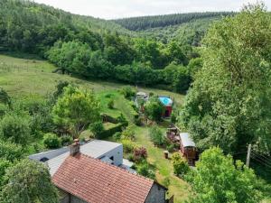 an aerial view of a farm with a house and trees at Maison isolée avec spa nordique, piscine et jardin privatif au cœur de la nature - FR-1-497-116 in La Lande-de-Goult