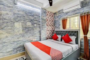 Ένα ή περισσότερα κρεβάτια σε δωμάτιο στο Hotel O New Rainbow Palace