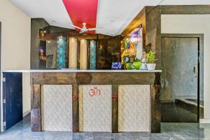 a bar in a room with a ceiling at Capital O Geeta Palace in Mumbai