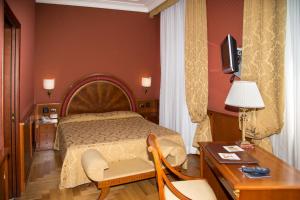 Posteľ alebo postele v izbe v ubytovaní Livingston Hotel