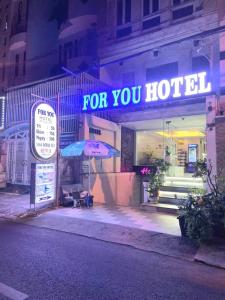 a store with a sign that says for you hotel at For You Hotel in Ho Chi Minh City