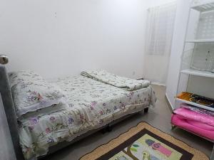 a bedroom with two beds and a rug at Homestay Kuala Selangor Islamic Friendly Only in Kuala Selangor +9 photos