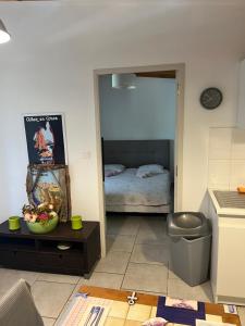 a room with a bedroom with a bed in it at Bonifacio tranquillité paradis in SantʼAmanza