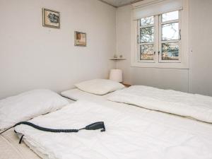 Ένα ή περισσότερα κρεβάτια σε δωμάτιο στο 4 person holiday home in Haderslev