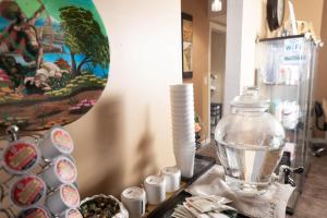 a table with a glass vase and a bowl of water at Tania's guest rooms in Calgary