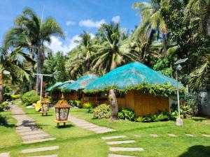 Taman di luar Nanay Santa's Garden Beach Resort +6 gambar