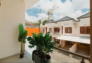a view from the balcony of a house with plants at Veeka Villa in Nusa Dua