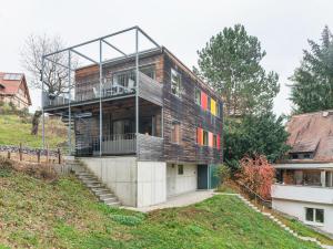 a house on a hill with a building at Waldnahes Ferienhaus in Freital in Freital