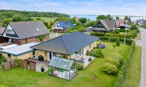 an aerial view of a house with a solar roof at Holiday Home In South Funen Near Beach in Fåborg