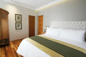Postel nebo postele na pokoji v ubytování Quiral Hotel Boutique