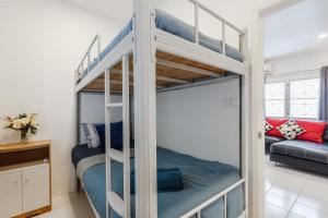 a bunk bed room with a bunk bed in a room at Karon Beach Holiday Home 1 in Karon Beach