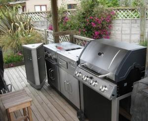 a grill and a smoker on a deck at Applaud BnB in Drury