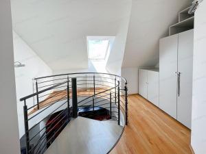 a room with a bunk bed in a attic at Bem in Kecskemét