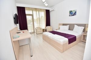 Postel nebo postele na pokoji v ubytování Q Hotel + 37 fotografií