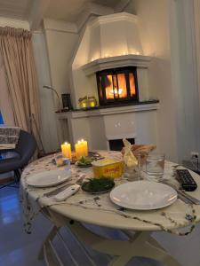 a table with two plates and candles on it at Pollyville in Lillesand +12 photos