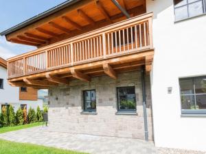 a deck on the side of a house at Chalet in Niedernsill near Ski Slopes in Niedernsill