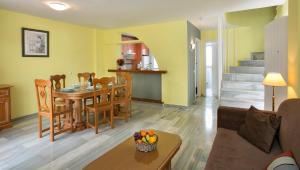 a living room with a table and a dining room at Ona Campanario in La Cala de Mijas