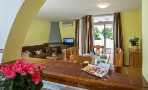 a living room with a table and a couch at Ona Campanario in La Cala de Mijas