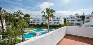 a view of the pool from the balcony of a hotel at Ona Campanario in La Cala de Mijas