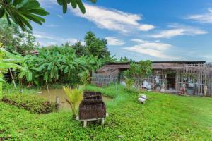 Zahrada ubytování OYO 749 Baan Suan Resort