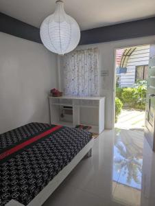 Ένα ή περισσότερα κρεβάτια σε δωμάτιο στο Point F Siargao