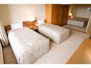 Postel nebo postele na pokoji v ubytování HOTEL WINDSOR + 44 fotografií