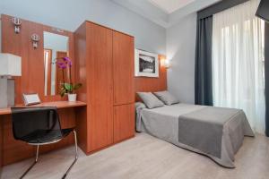 Ένα ή περισσότερα κρεβάτια σε δωμάτιο στο Reyes Suite & Rooms