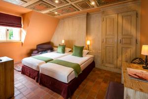 Postel nebo postele na pokoji v ubytování Hotel Restaurant De l'Illwald