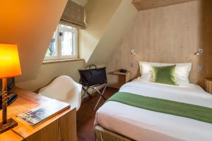 Postel nebo postele na pokoji v ubytování Hotel Restaurant De l'Illwald