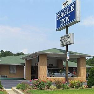 a breakle inn sign in front of a building at Eagle Inn Sumter in Sumter