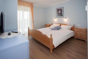 Posteľ alebo postele v izbe v ubytovaní Villa Vinka