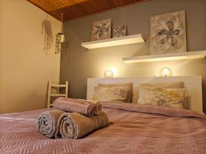 a bedroom with a bed with towels on it at Peaceful house for relaxing in Oulu