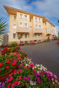 a large building with flowers in front of it at Ayasofya Hotel - Special Class in Istanbul