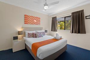 a bedroom with a large bed and a window at Turtle Beach 250 in Gold Coast +20 photos