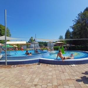 a group of people in a swimming pool at 6RoomS HÉVÍZ-BALATON in Hévíz
