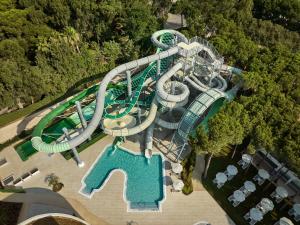 an overhead view of a water park with a water slide at Paloma Grida in Belek