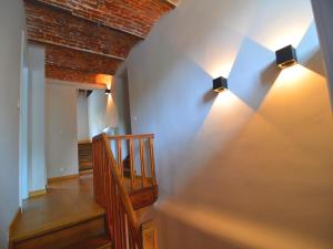 a hallway with two lights on the wall at Gite with swimming pool situated in wonderful castle grounds in Gesves in Gesves