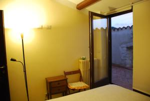 Il Paradiso nel Borgo tesisinde bir odada yatak veya yataklar