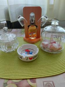 a table with a plate of food and a jar of sugar at stancicmilena in Požarevac