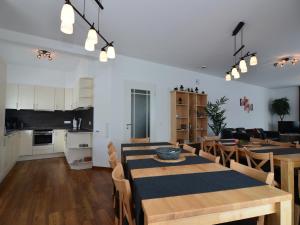 a dining room and kitchen with a table and chairs at Moderne Villa in Medebach Küstelberg in Medebach